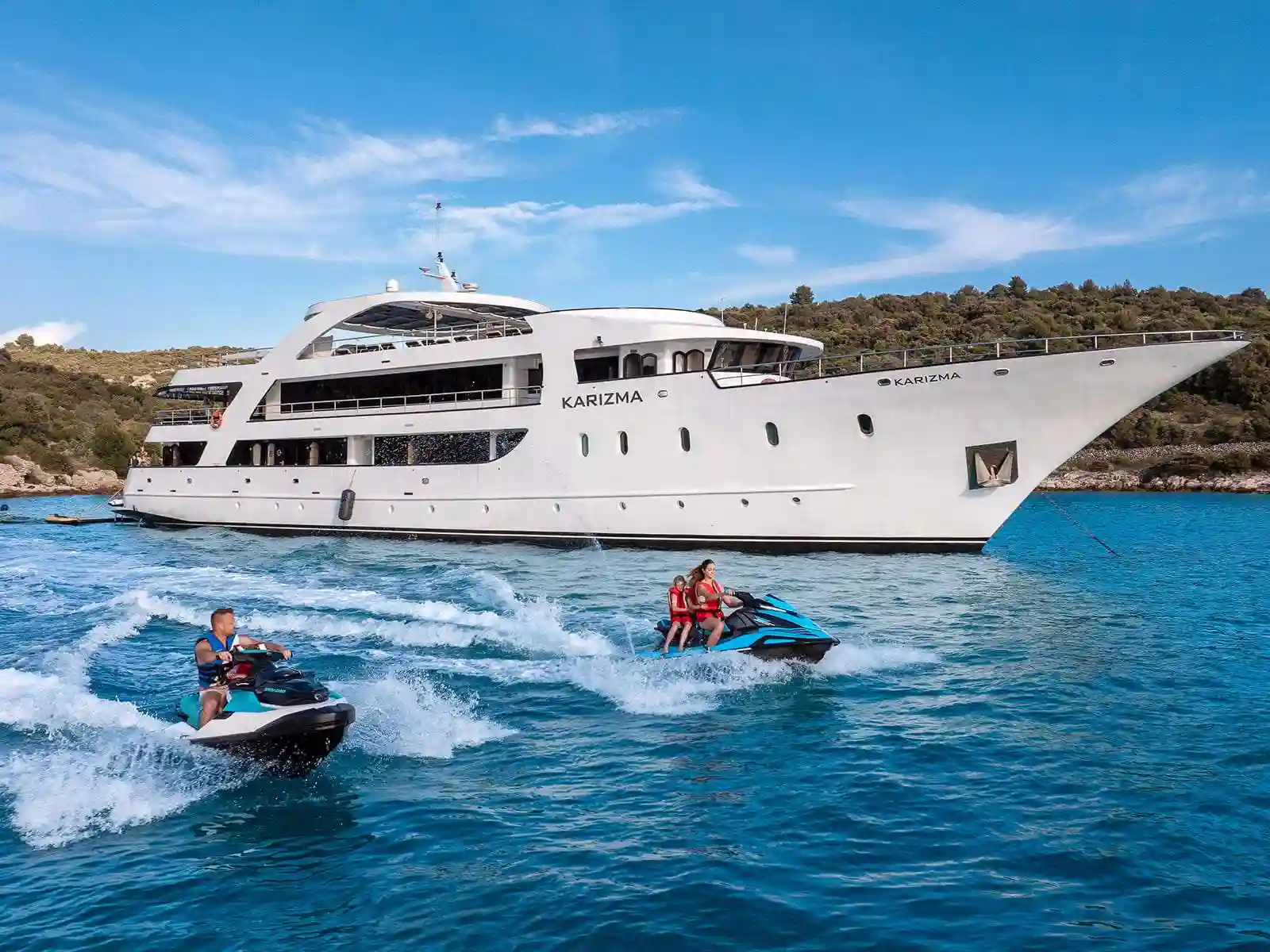 Karizma, a motor yacht, anchored near an island in the Adriatic.