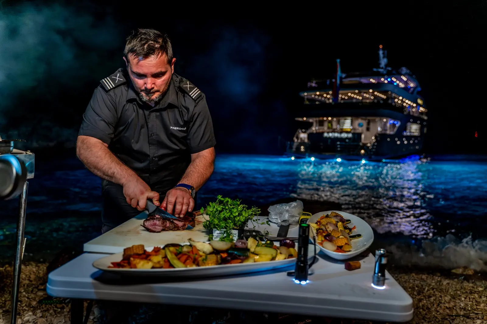 A chef preparing dinner for a Croatia yacht charter.